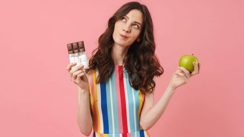 A person confidently choosing healthy snacks - FitnessPal